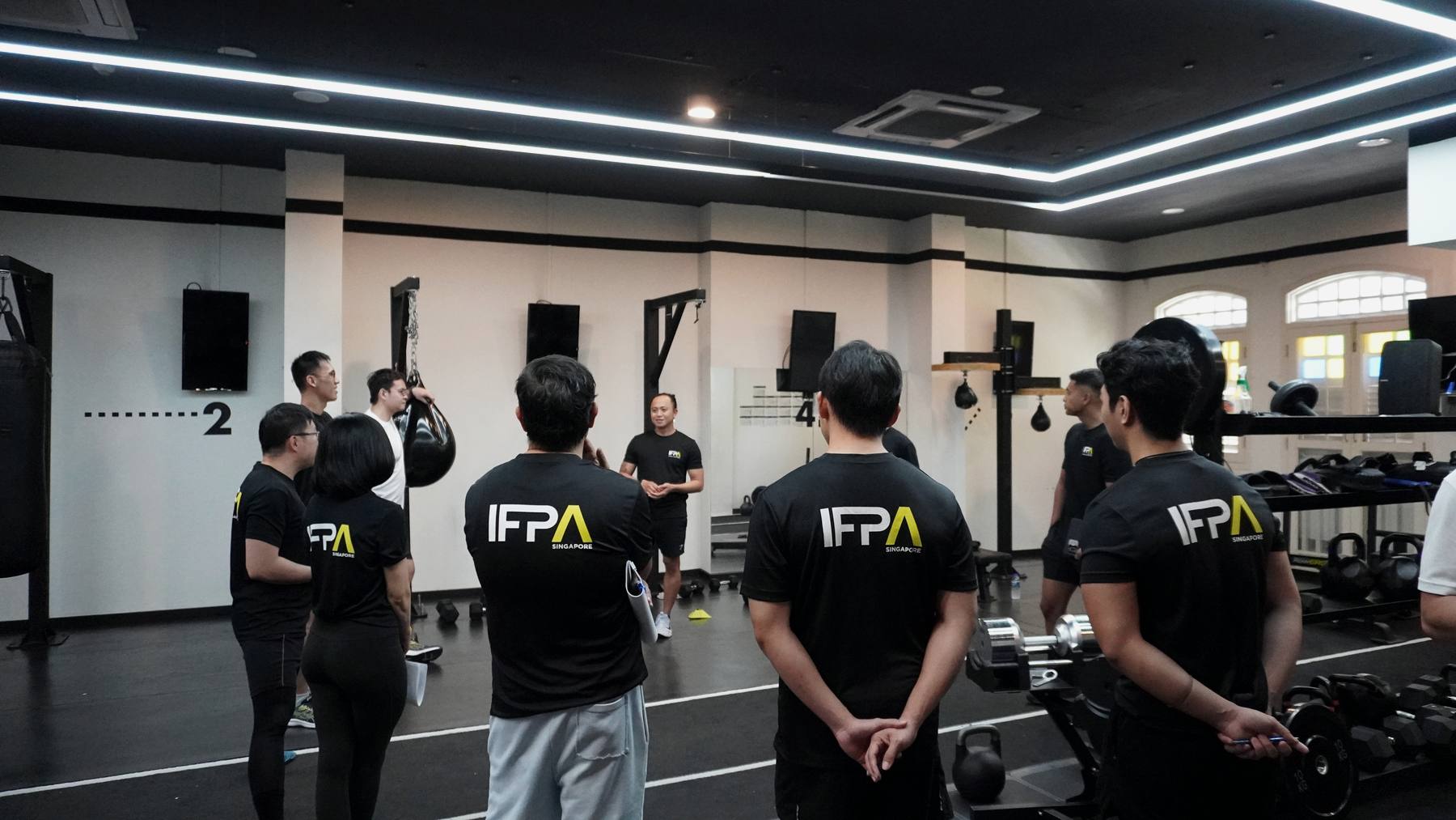 IFPA trainees at an in-person coaching briefing